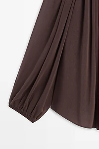 Flowing shirt with gathered details