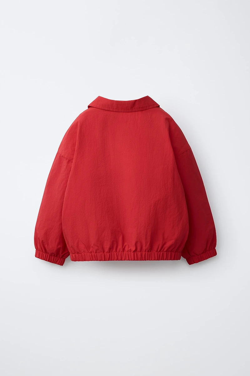 LIGHTWEIGHT EMBROIDERED TEXT WATER REPELLENT RAINCOAT