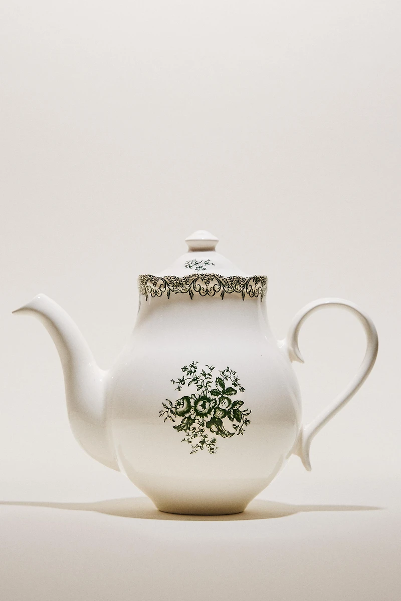 THÉIÈRE EN FAÏENCE À MOTIF FLORAL