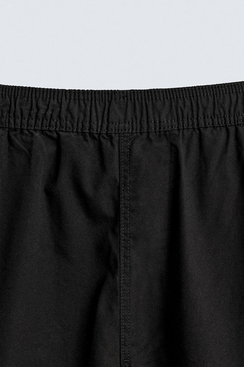 BALLOON FIT PLEATED PANTS