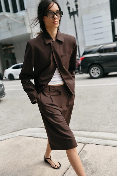 LONG PLEATED SHORTS