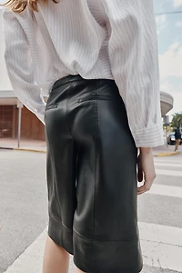 FAUX LEATHER LONG SHORTS
