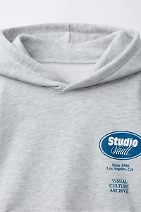 RAISED TEXT HOODIE SWEATSHIRT