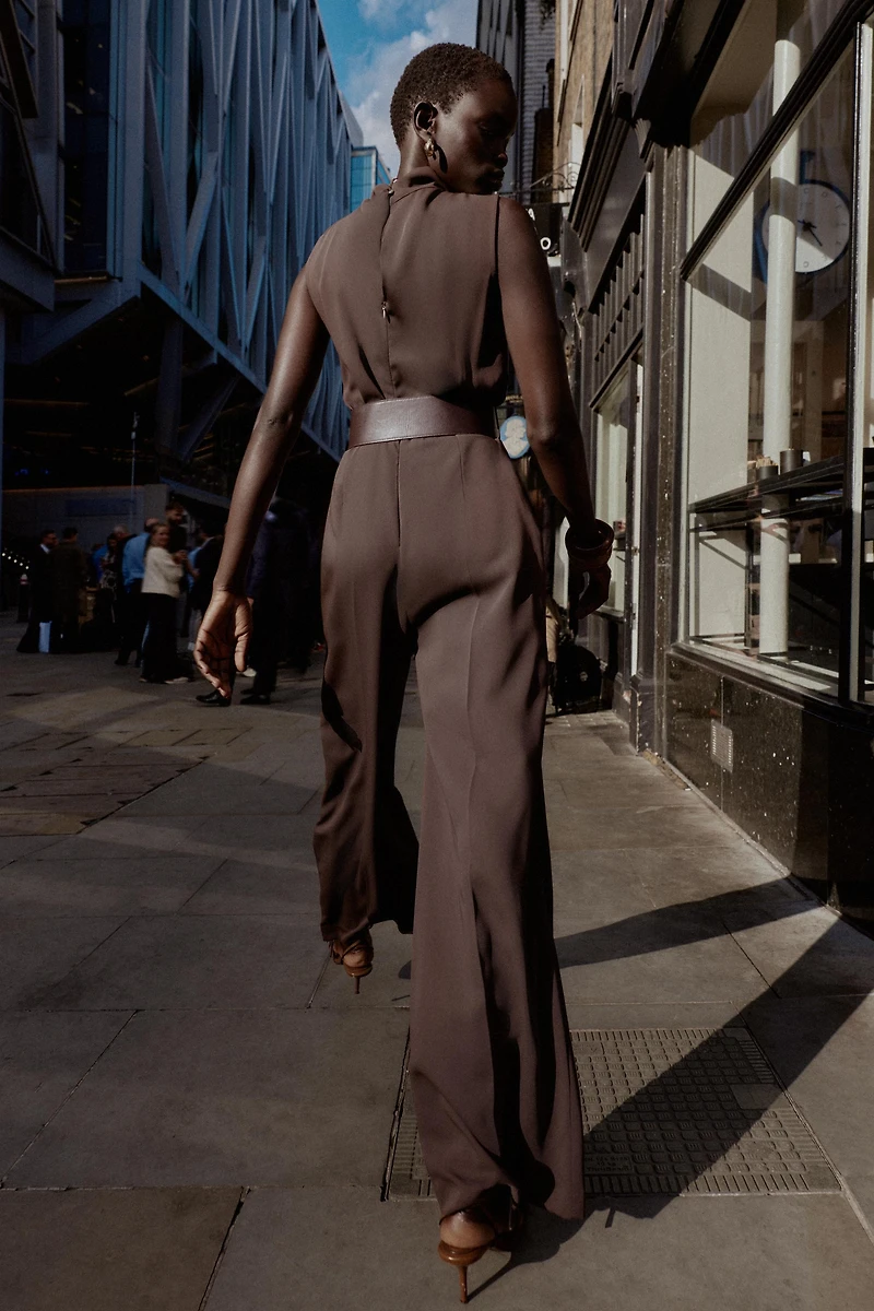 SLEEVELESS BELTED JUMPSUIT