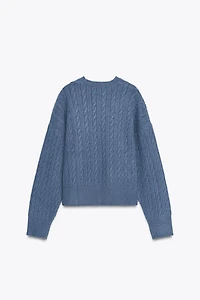 PULL EN MAILLE À TORSADES