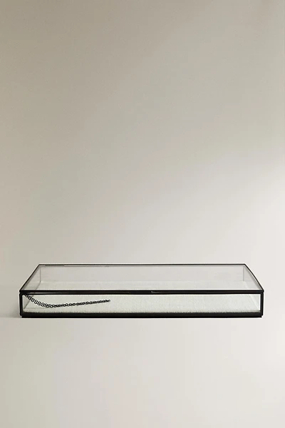 JEWELRY BOX WITH A BLACK METAL BORDER