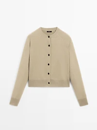 Short knit cardigan with raglan sleeves