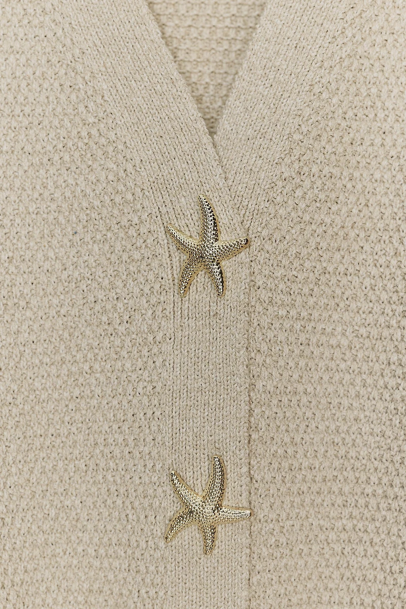 VESTE STRUCTURÉE EN MAILLE BOUTON ÉTOILE