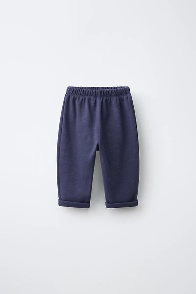 LABEL POCKET TROUSERS