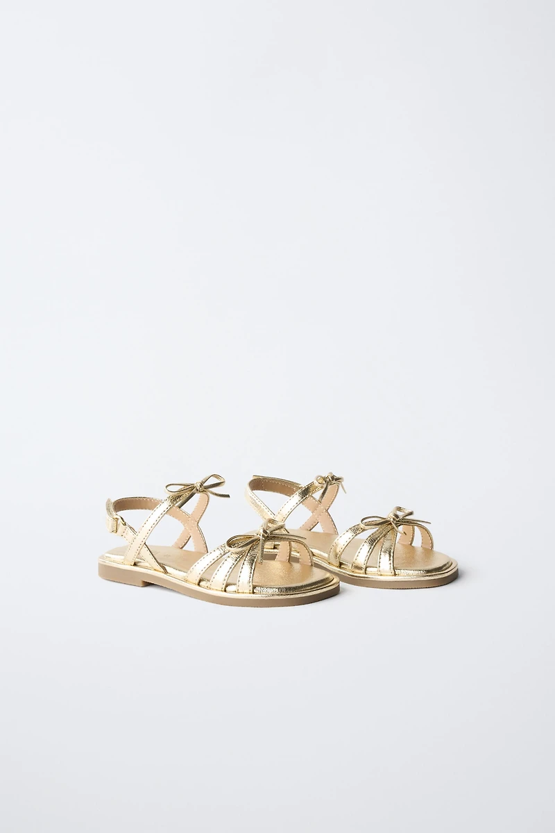 METALLIC BOW SANDALS