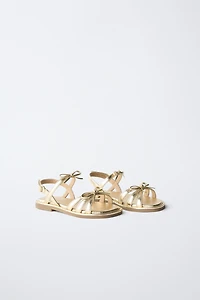 METALLIC BOW SANDALS