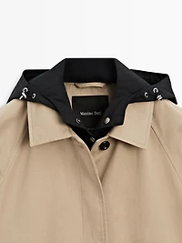 Cape trench coat with detachable hood