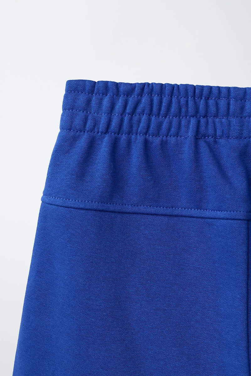 SHORT EN MOLLETON UNI