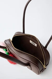 SAC PORTÉ ÉPAULE À CHARMS