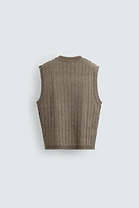 GILET EN TRICOT RÉVERSIBLE EFFET ENVERS