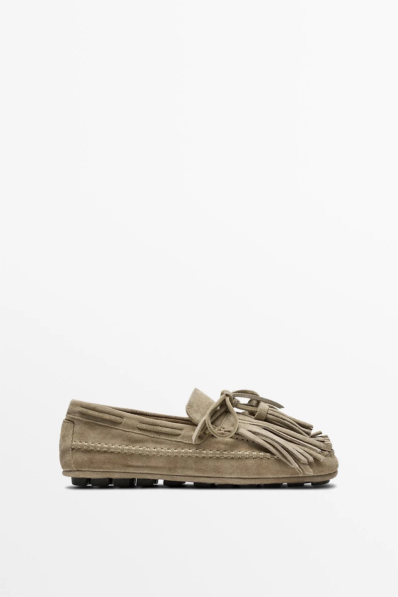 Leather loafers with fringing and tassels