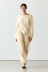 Asymmetric linen blend sweater with tie detail