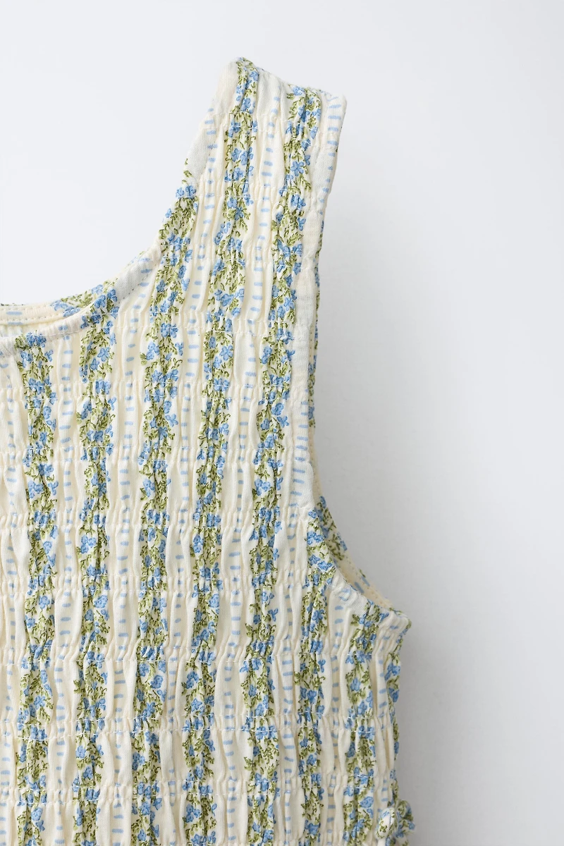 ELASTICIZED TIE TOP
