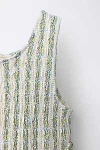 ELASTICIZED TIE TOP