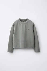 SWEAT CÔTELÉ À INSCRIPTION AVEC MODAL