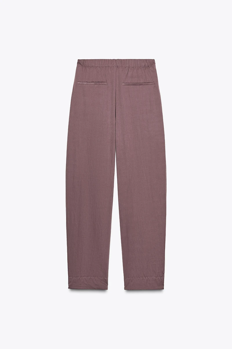NYLON PANTS WITH BUTTON HEM