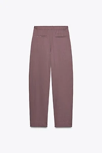 NYLON PANTS WITH BUTTON HEM