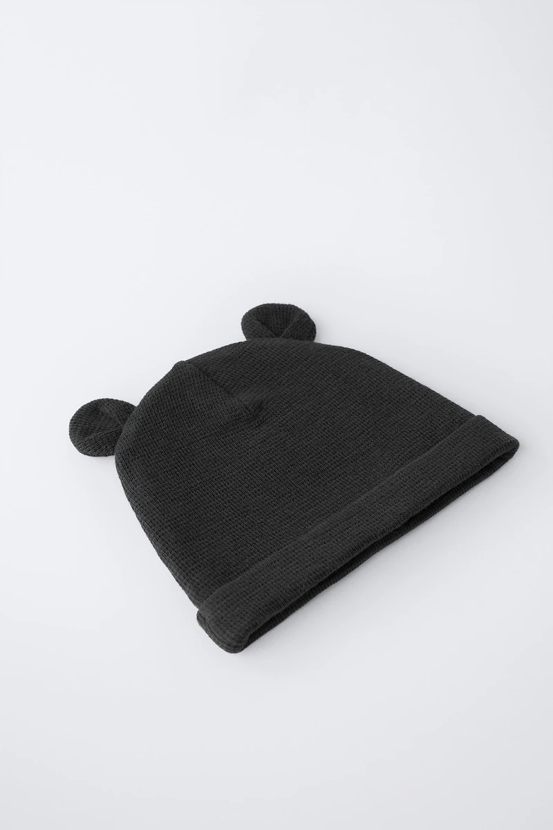 TWO-PACK OF WAFFLE KNIT EAR HATS WITH ANIMAL PRINT