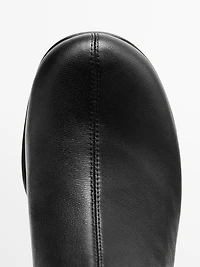 High-heel boots with rounded vamp