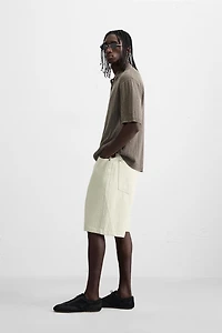 POLO EN MAILLE STRUCTURÉE DÉLAVÉE