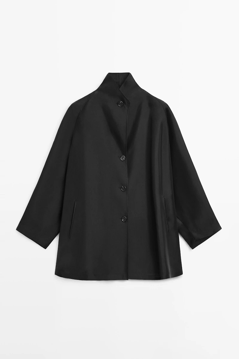Flowing voluminous cape with button details
