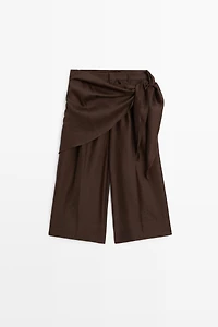 Long flowing Bermuda shorts with scarf detail