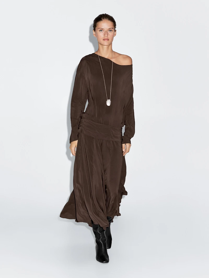 Long flowing dress with draped sash belt