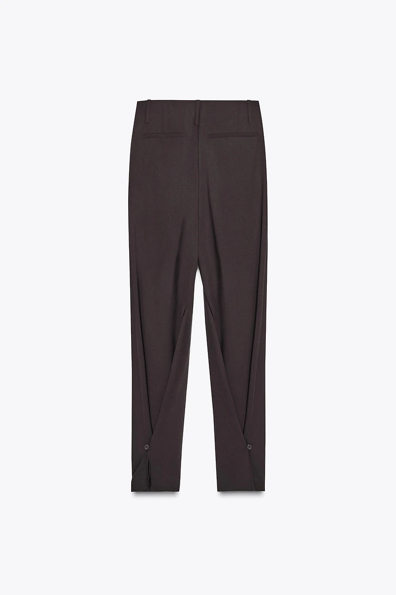 PLEATED PANTS WITH BUTTON HEM