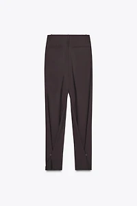 PLEATED PANTS WITH BUTTON HEM