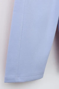 WIDE LEG INTERLOCK RAISED TEXT PANTS