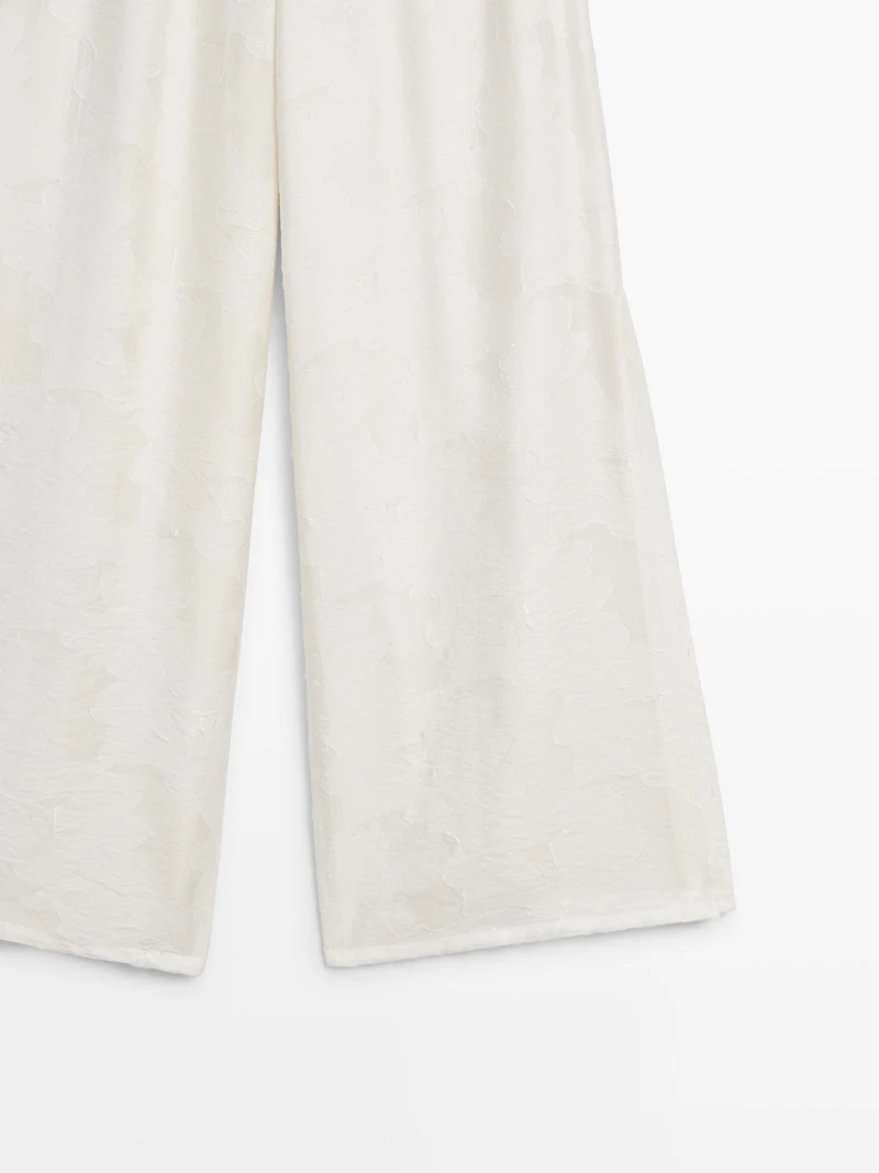 Pantalon élastique fluide détail tissu