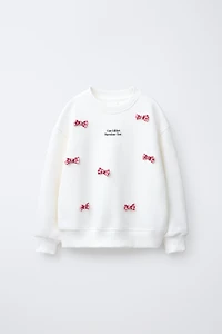 TEXT AND BOWS SWEATSHIRT