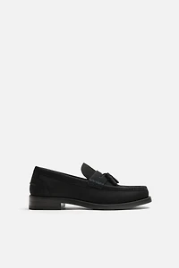 MOCASSINS EN CUIR À POMPONS