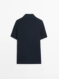 Polo en maille torsadée à col V