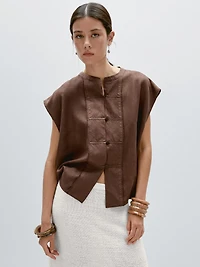 Veste sans manches plastron boutonné