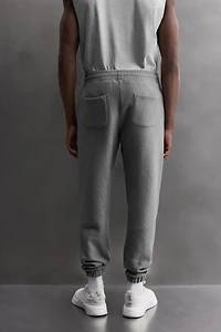 JOGGING PANTS WITH PRINTED TEXT