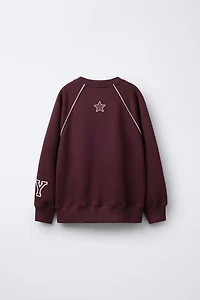 RAGLAN SLEEVE SWEATSHIRT WITH TEXT AND NUMBER