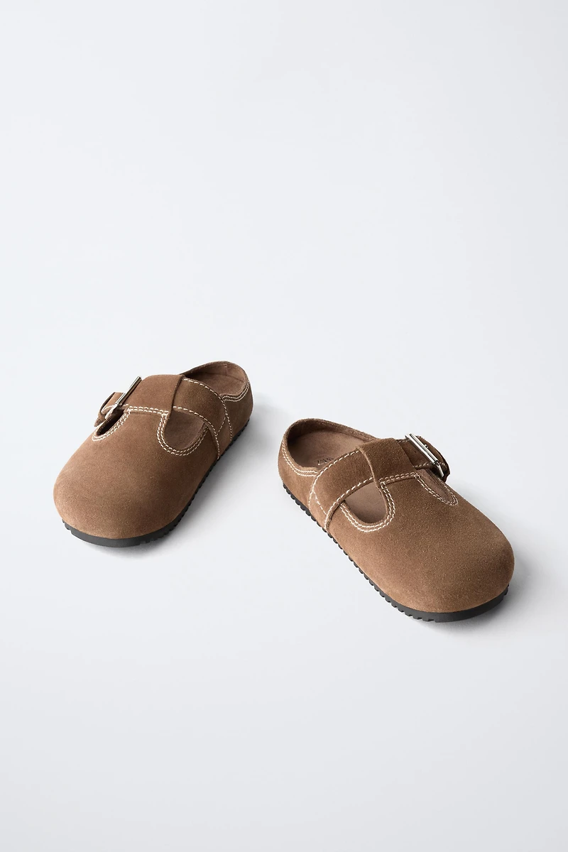 SABOTS EN CUIR AVEC SURPIQÛRES