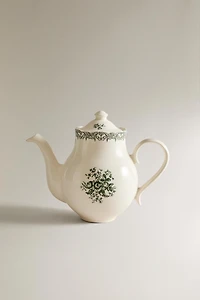 THÉIÈRE EN FAÏENCE À MOTIF FLORAL