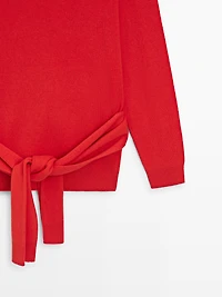 100% wool knit sweater with waist detail