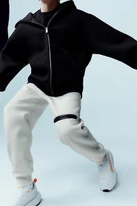 NEOPRENE-LOOK LABEL JACKET