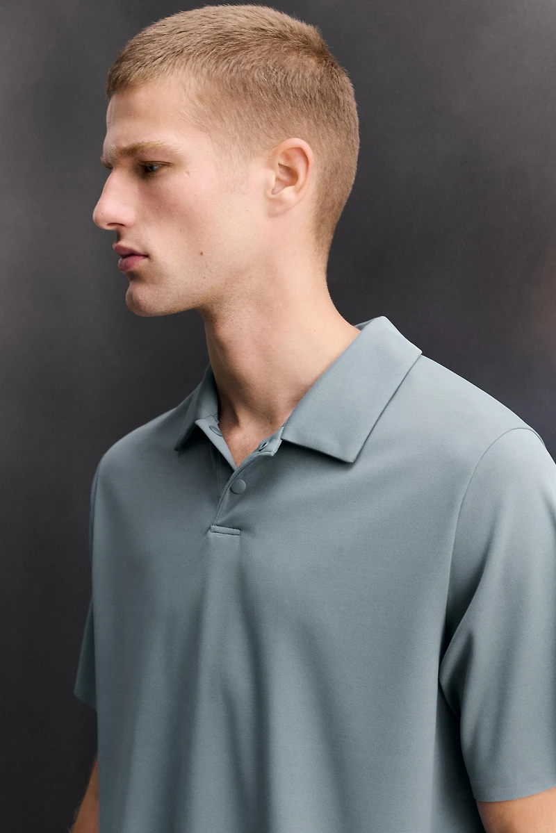 TECHNICAL PIQUÉ TRAINING POLO