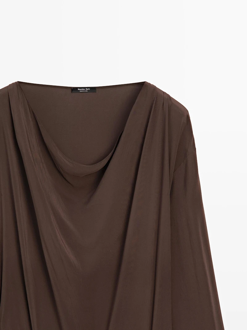 Long flowing dress with draped sash belt