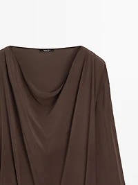 Long flowing dress with draped sash belt