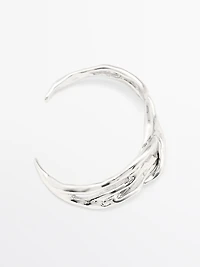 Bracelet métallique abstrait